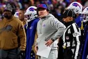 Buffalo Bills head coach Sean McDermott, center, looks at the scoreboard during the first half of an NFL football game against the New York Jets in Orchard Park, N.Y., Sunday, Nov. 19, 2023. (AP Photo/Jeffrey T. Barnes )