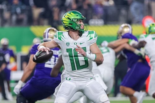 Oregon quarterback Bo Nix (10) gets set for a pass as the No. 5 Ducks take on the No. 3 Washington Huskies in the Pac-12 championship game on Friday, Dec. 1, 2023, at Allegiant Stadium in Las Vegas.