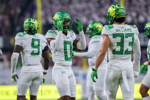 Oregon defenders Tysheem Johnson (0) and Evan Williams (33) react as the No. 5 Ducks take on the No. 3 Washington Huskies in the Pac-12 championship game on Friday, Dec. 1, 2023, at Allegiant Stadium in Las Vegas.