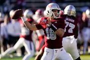 Troy quarterback Gunnar Watson (18) works in the pocket against Louisiana-Lafayette during the first half of an NCAA college football game, Saturday, Nov. 18, 2023, in Troy, Ala. (AP Photo/Mike Stewart)