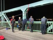 The person, not identified by authorities, had climbed over a railing and was too far below the road deck to be reached, and the fire department’s High Angle Ropes Team was called to the scene.