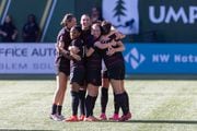 Portland Thorns players celebrate after a goal by Hina Sugita in the 54th minute during an NWSL match against NJ/NY Gotham FC at Providence Park on Saturday, Oct. 7, 2023. 