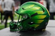 SAN ANTONIO, TX - DECEMBER 29: A Duck helmet awaits the next series during the football game between the Oregon Ducks and Oklahoma Sooners at the Alamodome on December 29, 2021 in San Antonio, TX. (Photo by Ken Murray/Icon Sportswire via Getty Images)