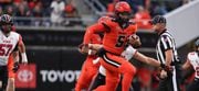 Oregon State quarterback DJ Uiagalelei (5) dodges Utah cornerback Tao Johnson (15) during the first half of an NCAA college football game Friday, Sept. 29, 2023, in Corvallis, Ore.