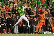Oregon wide receiver Tez Johnson (15) leaps to catch a pass during the first half as the No. 6 Ducks take on the No. 16 Oregon State Beavers in a Pac-12 football game on Friday, Nov. 24, 2023, at Autzen Stadium in Eugene. Oregon won 31-7 to clinch a spot in the Pac-12 championship game.