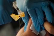 A nurse administers a Moderna COVID-19 booster vaccine at an inoculation station next to Jackson State University in Jackson, Miss., Friday, Nov. 18, 2022.  U.S. regulators on Tuesday, April 18, 2023,  cleared another COVID-19 booster dose for older adults and people with weak immune systems so they can shore up protection this spring — while taking steps to make coronavirus vaccinations simpler for everyone else.(AP Photo/Rogelio V. Solis)