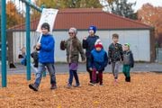 Students in the Russian language immersion program at Kelly Elementary School march across the school's playground on the sixth day of the Portland teachers strike.