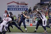 Seattle Seahawks quarterback Sean Mannion make a pass against the Denver Broncos during the second half of an NFL football preseason game, Saturday, Aug. 21, 2021, in Seattle. The Broncos won 30-3. (AP Photo/John Froschauer)