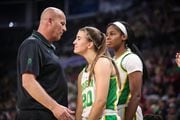 Oregon coach Kelly Graves talks to Sabrina Ionescu (center) and Ruthy Hebard (right) during the second halof as the No. 1 seed Oregon Ducks beat the No. 3 seed Stanford Cardinal 89-56 in the championship game of the Pac-12 women's basketball tournament on Sunday, March 8, 2020, at Mandalay Bay Events Center in Las Vegas. Photo by Serena Morones for The Oregonian/OregonLive